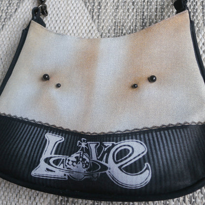 1 of 1 pierced torso print baguette bag
